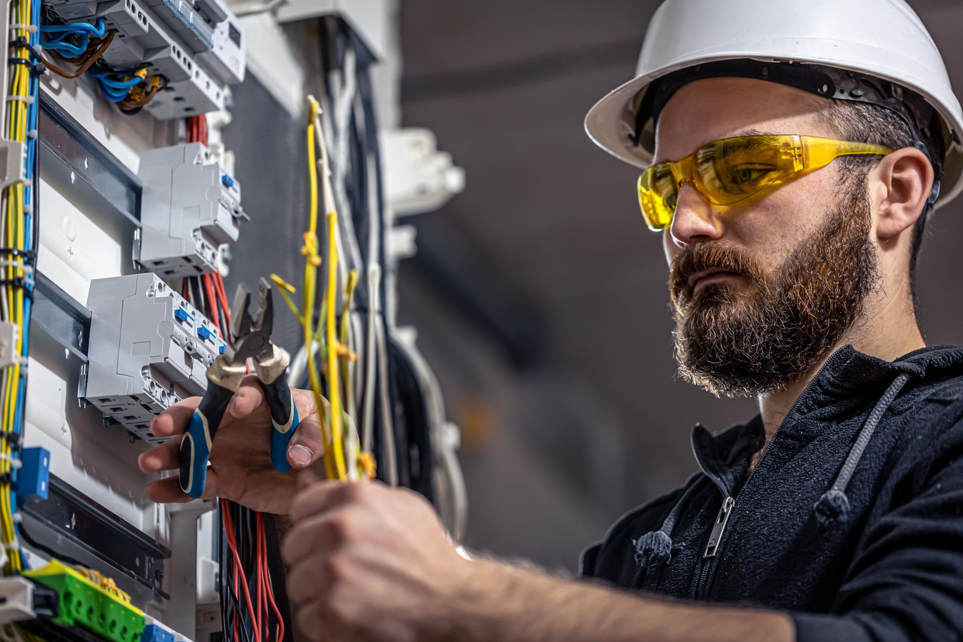 Electrician at work on a residential service panel